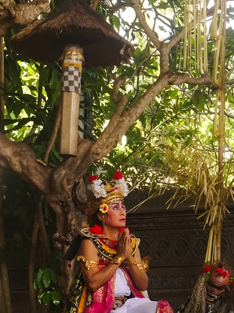 Performer in traditional costume during Uluwatu Kecak & Fire Dance Show, Bali.