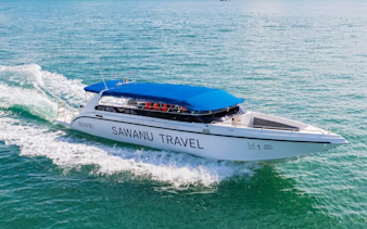 Speedboat cruising on clear waters during Phuket Phi Phi Khai Islands tour.