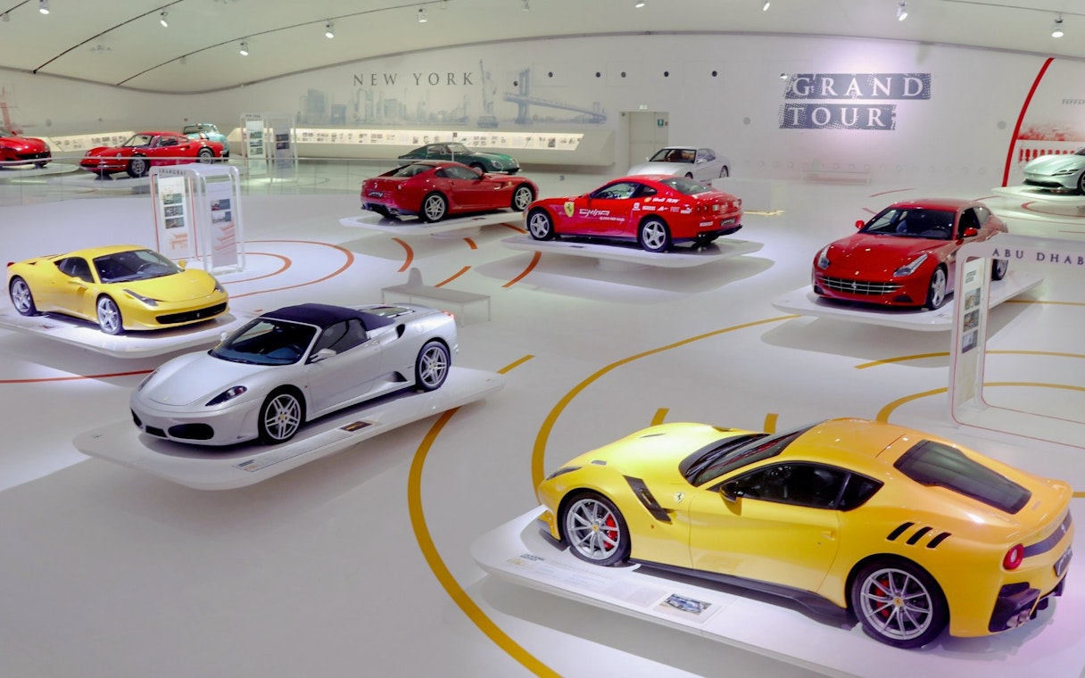 Ferrari cars displayed at Modena Ferrari Museum exhibit.