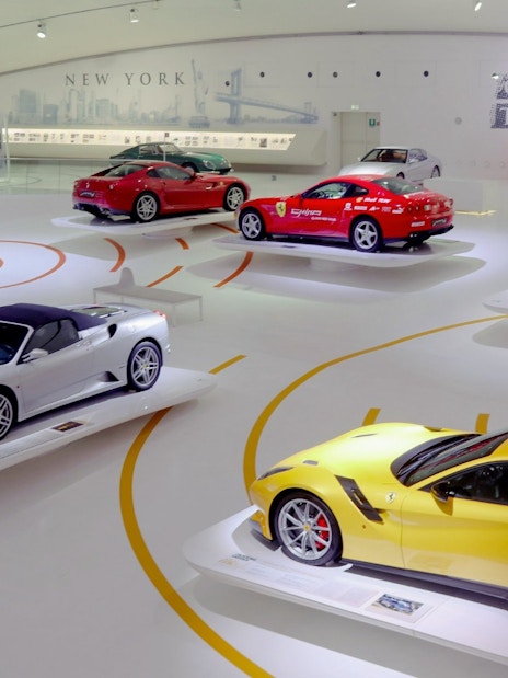 Ferrari cars displayed at Modena Ferrari Museum exhibit.