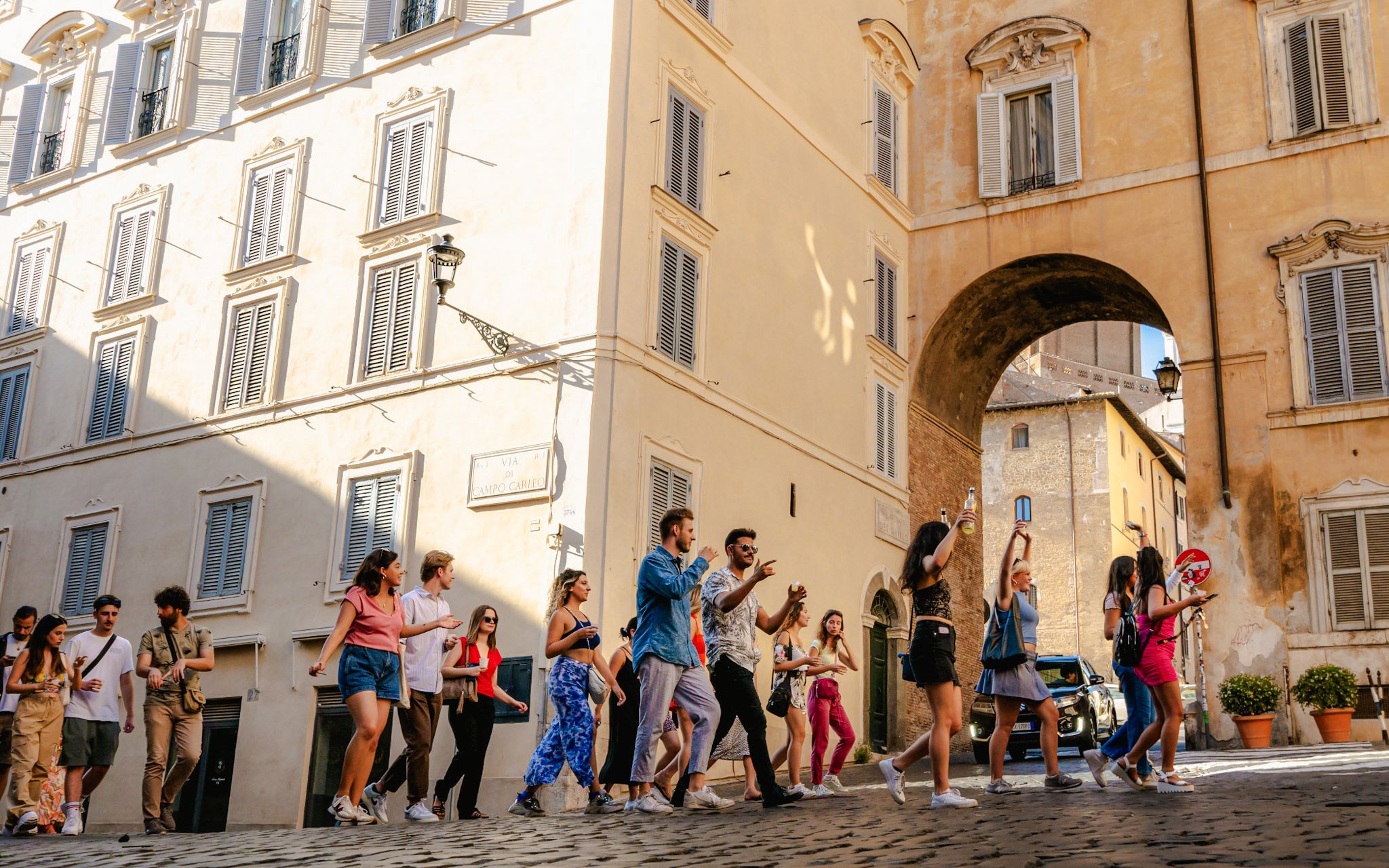 Guests enjoying the Tipsy Tour in Rome, walking through historic streets.