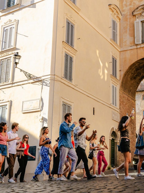 Guests enjoying the Tipsy Tour in Rome, walking through historic streets.