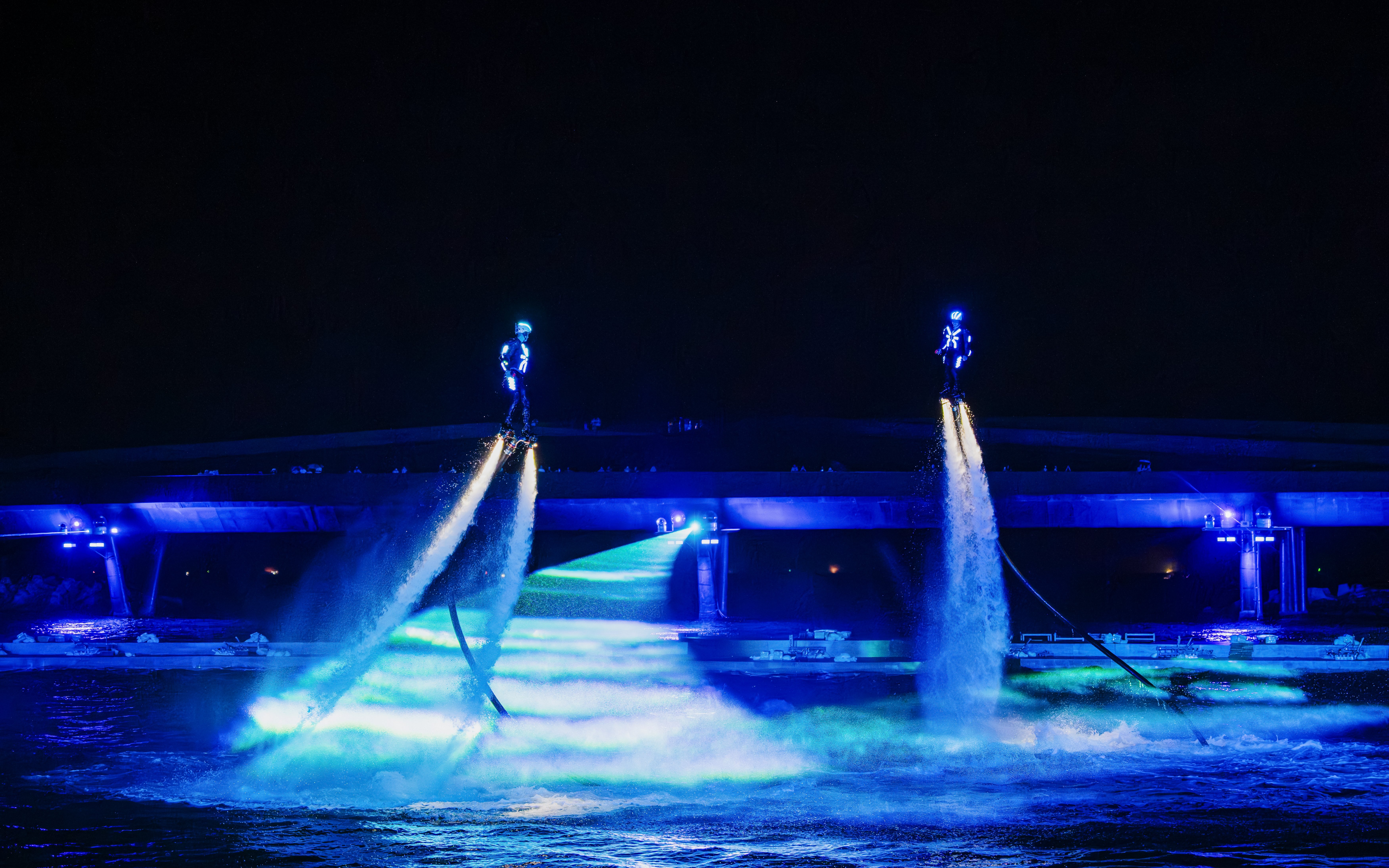 Performers using water jetpacks at Symphony of the Sea show.