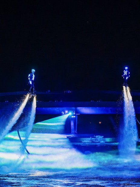 Performers using water jetpacks at Symphony of the Sea show.