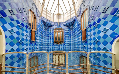 Casa Batlló interior with blue tiled walls and wooden windows, Barcelona.