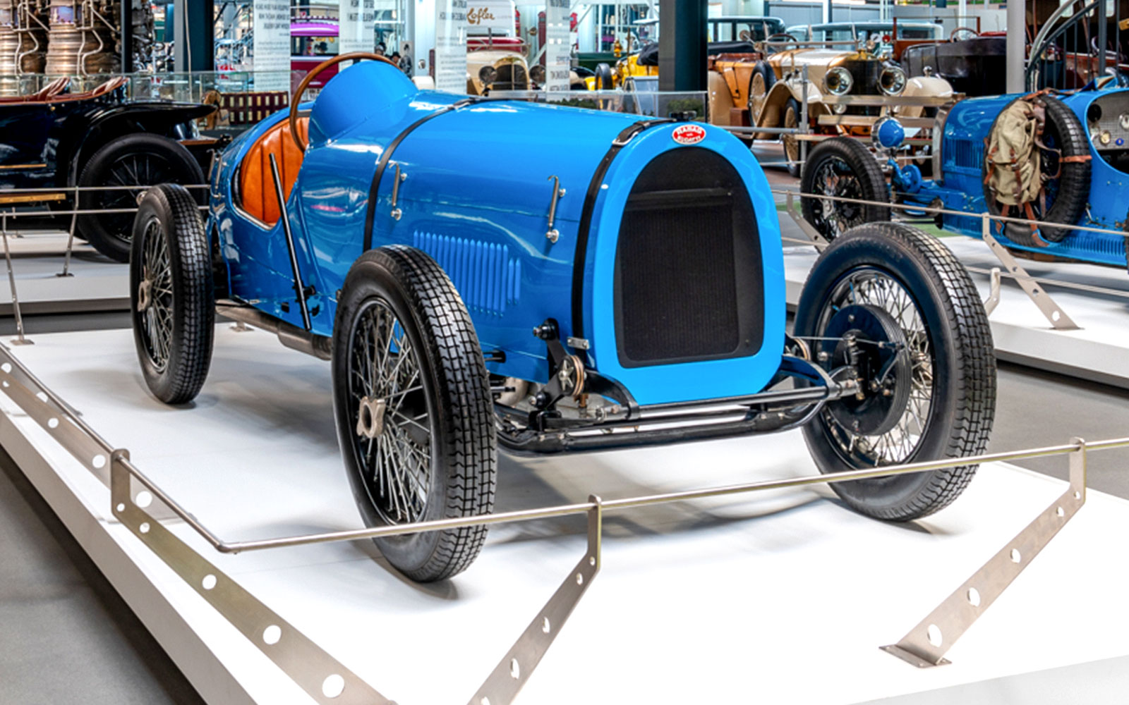Vintage blue race car on display at Technik Museum Sinsheim.