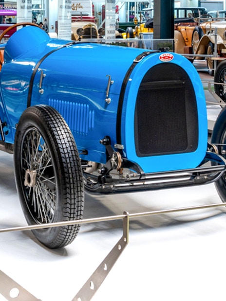 Vintage blue race car on display at Technik Museum Sinsheim.