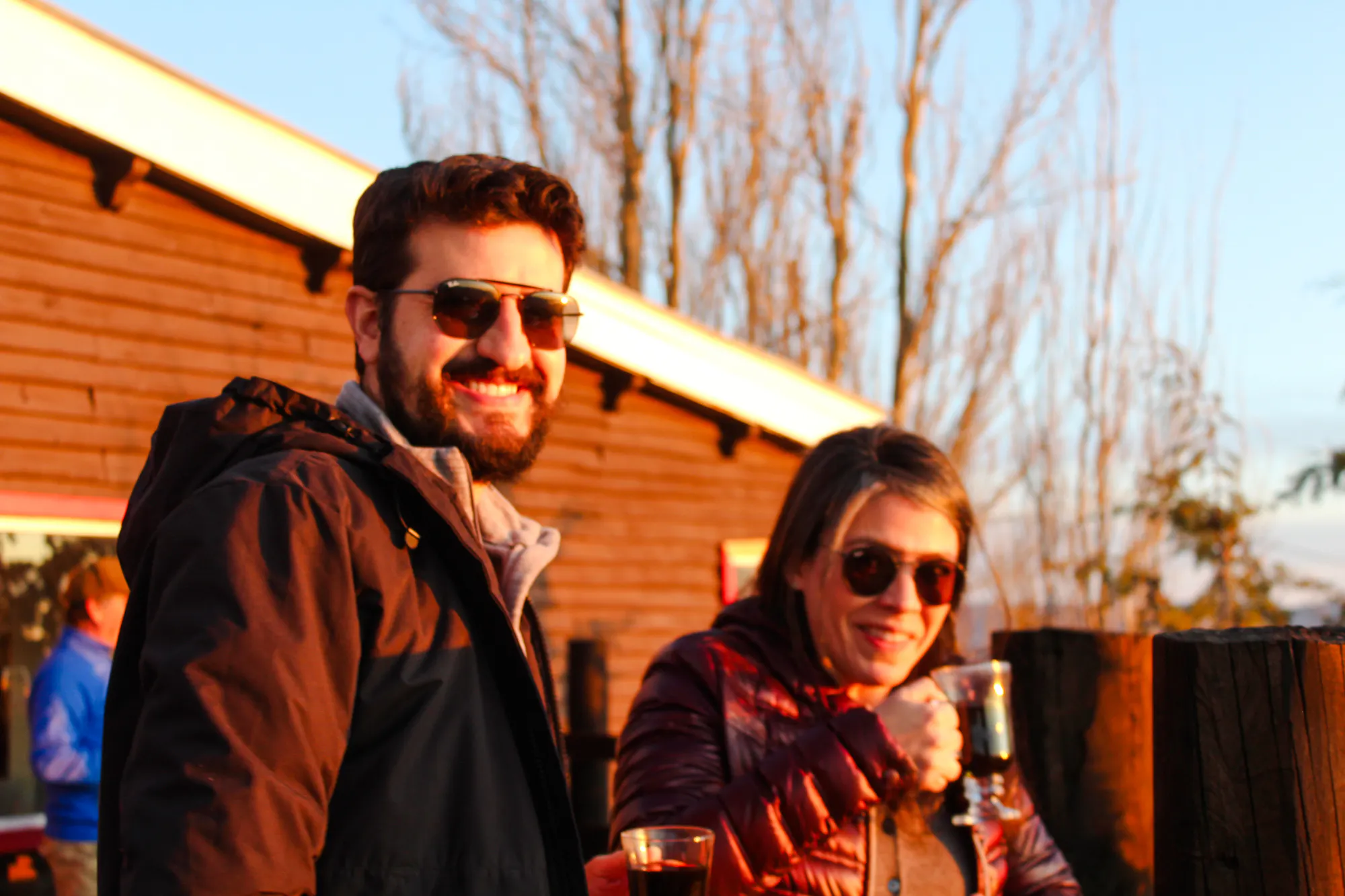 People enjoying drinks at sunset near the Andes Mountains, Santiago.