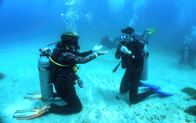 Scuba diving lesson in the Red Sea, Hurghada, with beginners practicing underwater skills.