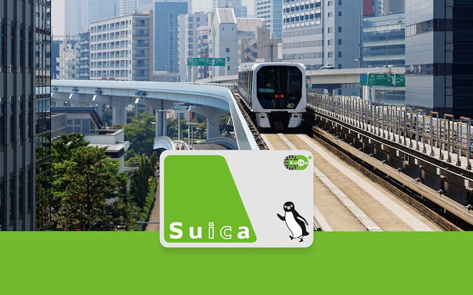 Suica IC Card with Tokyo monorail in urban background.