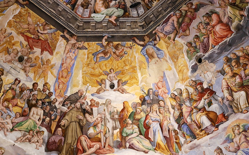 Close-up of frescoes inside Florence Cathedral depicting religious figures and angels.