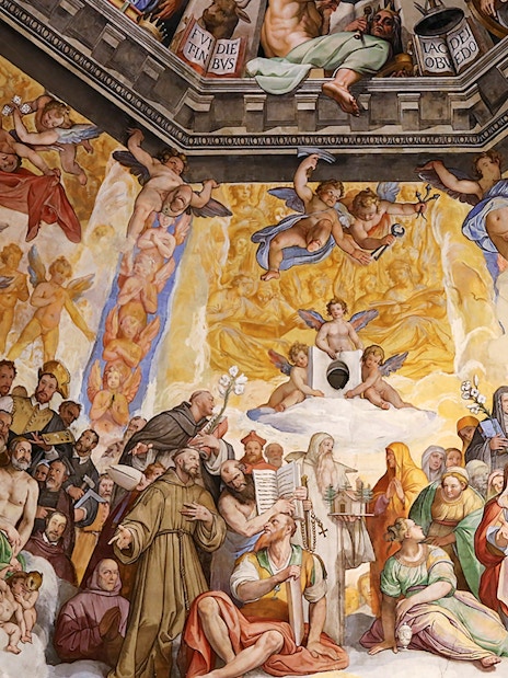 Close-up of frescoes inside Florence Cathedral depicting religious figures and angels.