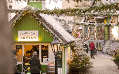 Cheesy Dreams food stall at Tivoli Gardens, Copenhagen, decorated for Christmas.