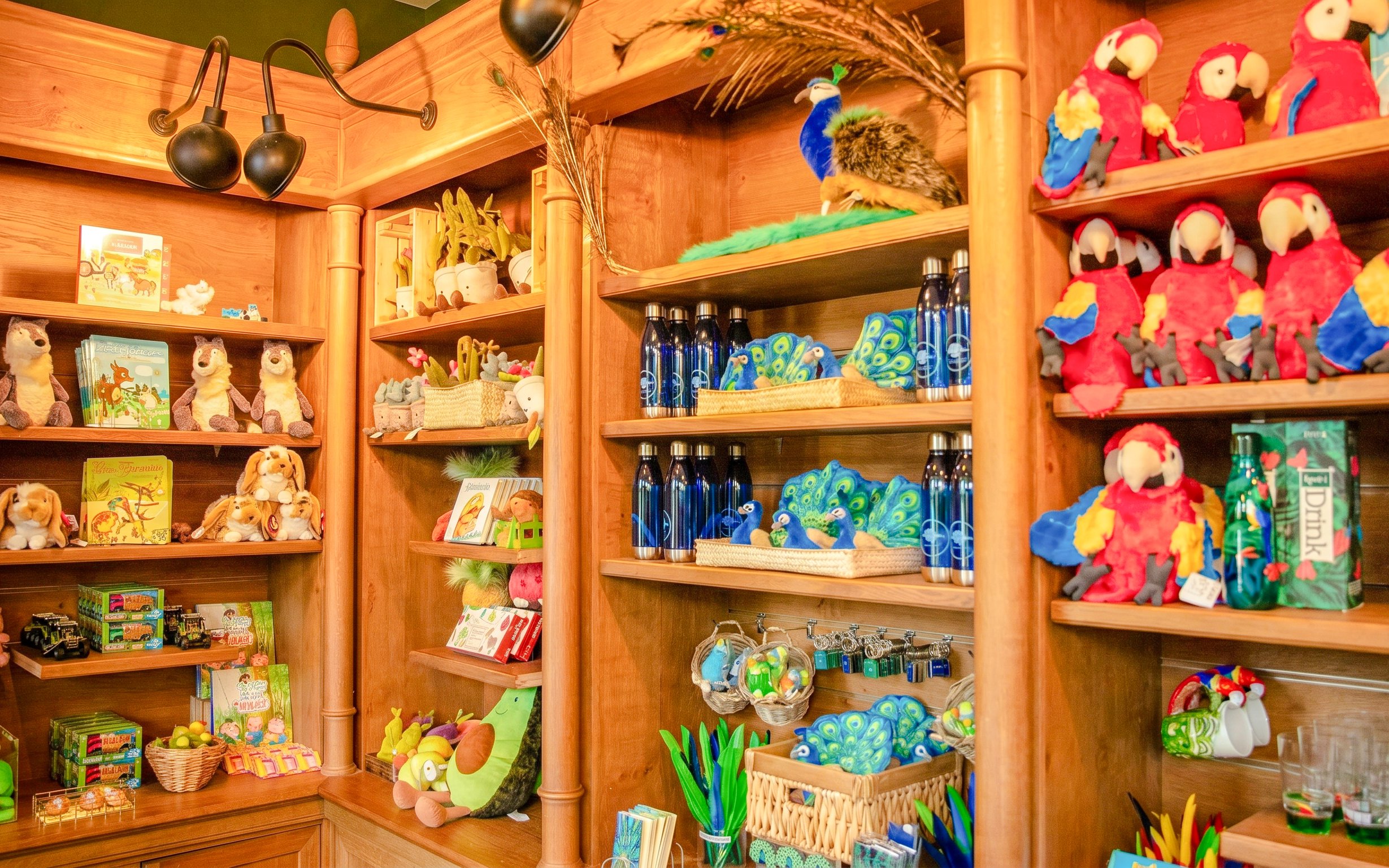 Gift shop shelves with plush animals and souvenirs at Jardin d'Acclimatation, Paris.