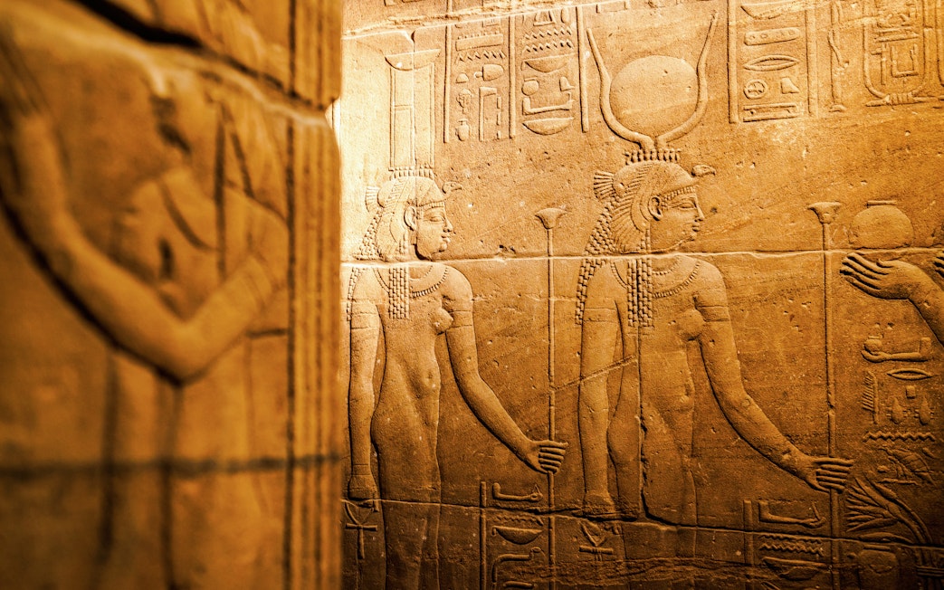 Engraving of pharaoh's daily life scenes in Isis Temple, Philae, Aswan.