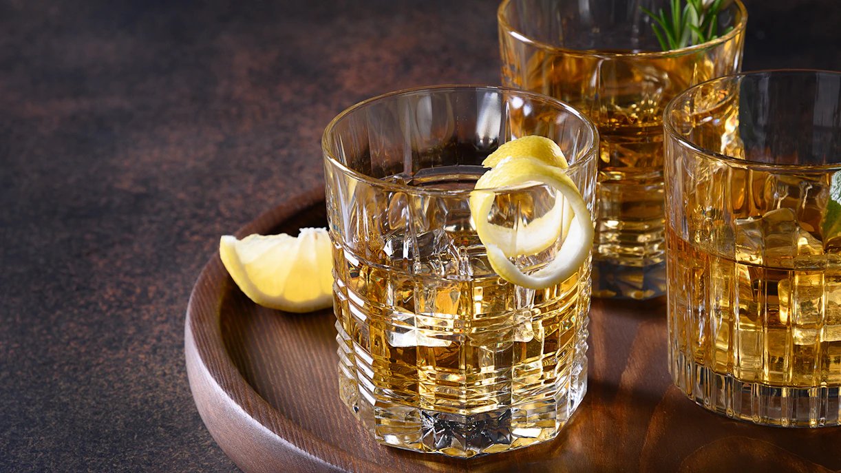 Whiskey glasses with lemon garnish at Le Magritte Bar & Terrace, The Beaumont.