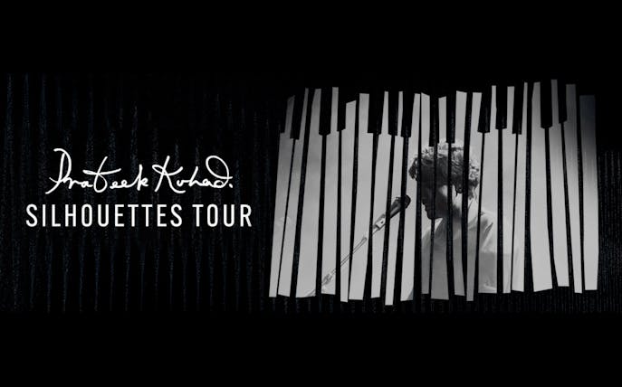 Prateek Kuhad performing on Silhouettes Tour in Dubai with piano keys backdrop.