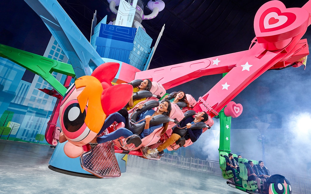 Visitors enjoying a themed ride at IMG Worlds of Adventure in Dubai.