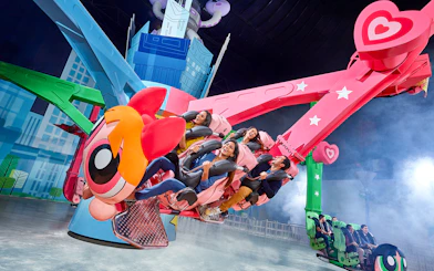 Visitors enjoying a themed ride at IMG Worlds of Adventure in Dubai.