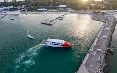 Rottnest Express ferry approaching jetty in turquoise waters, Rottnest Island.