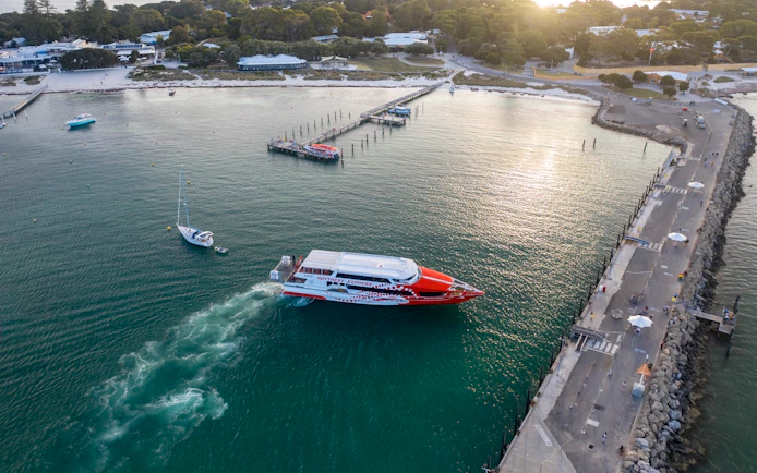 Rottnest Express ferry approaching jetty in turquoise waters, Rottnest Island.