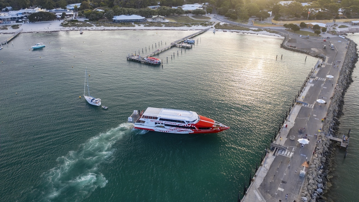 Rottnest Express ferry approaching jetty in turquoise waters, Rottnest Island.