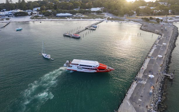 Rottnest Express ferry approaching jetty in turquoise waters, Rottnest Island.