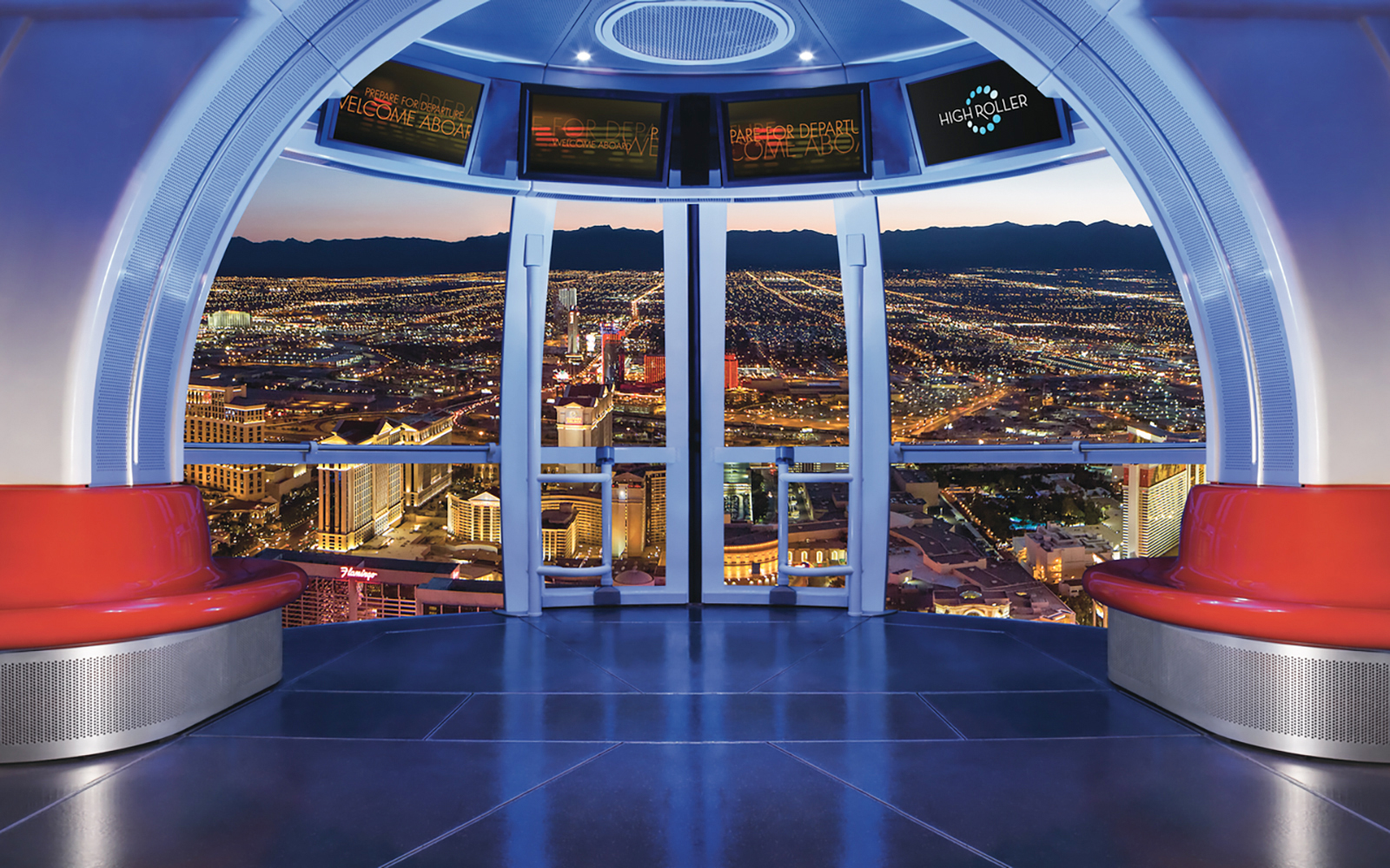 View from inside the Las Vegas High Roller Observation Wheel overlooking city lights.