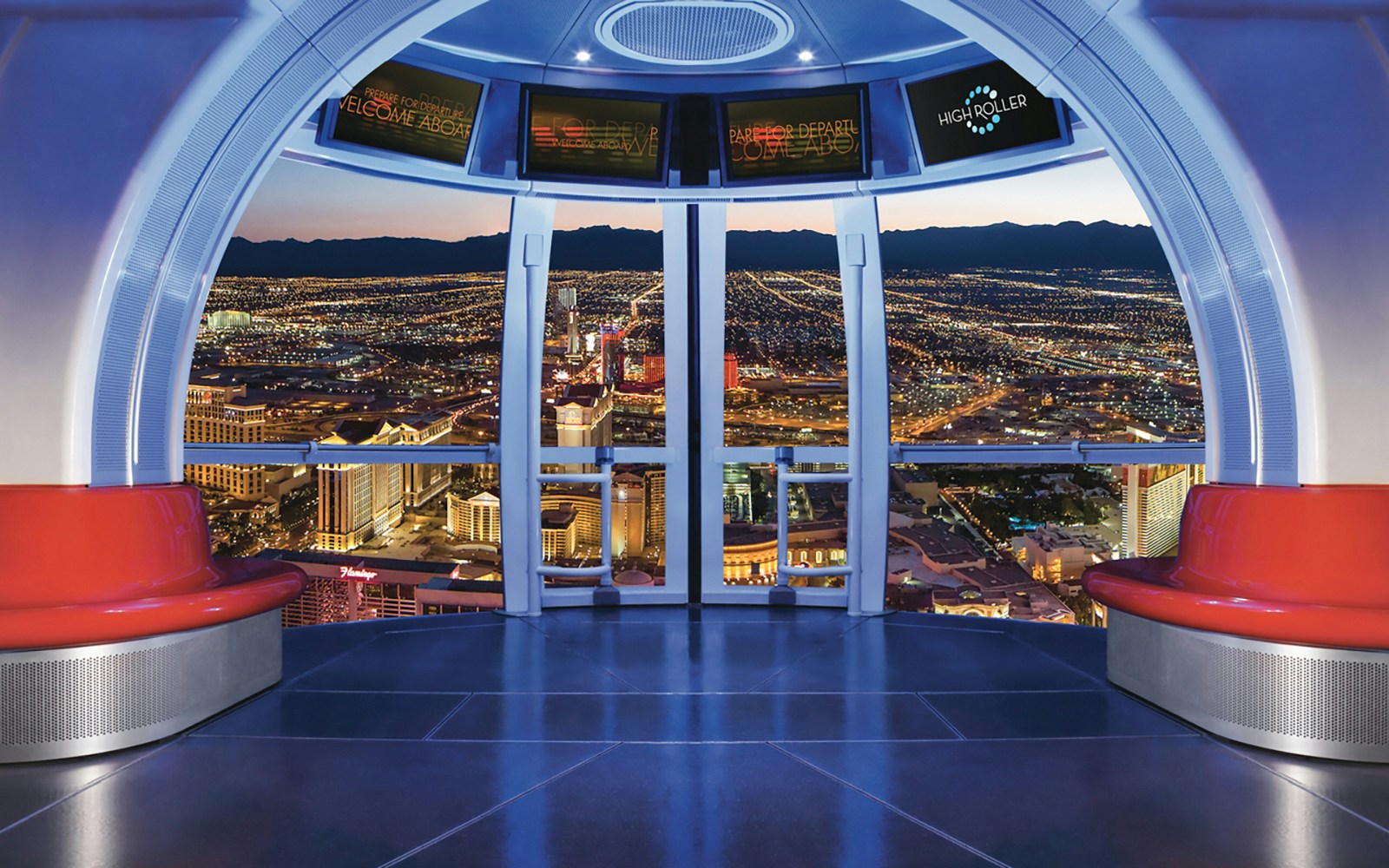 View from inside the Las Vegas High Roller Observation Wheel overlooking city lights.