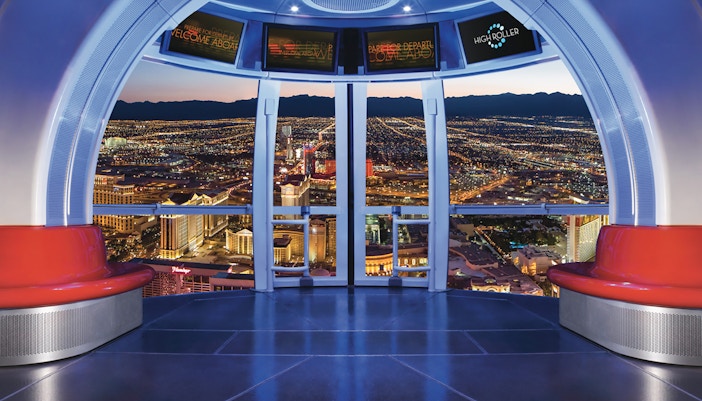 View from inside the Las Vegas High Roller Observation Wheel overlooking city lights.
