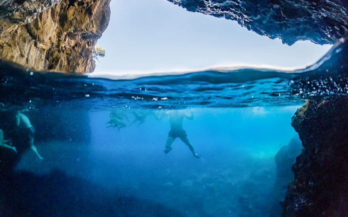 Snorkelers exploring underwater cave near Dubrovnik.
