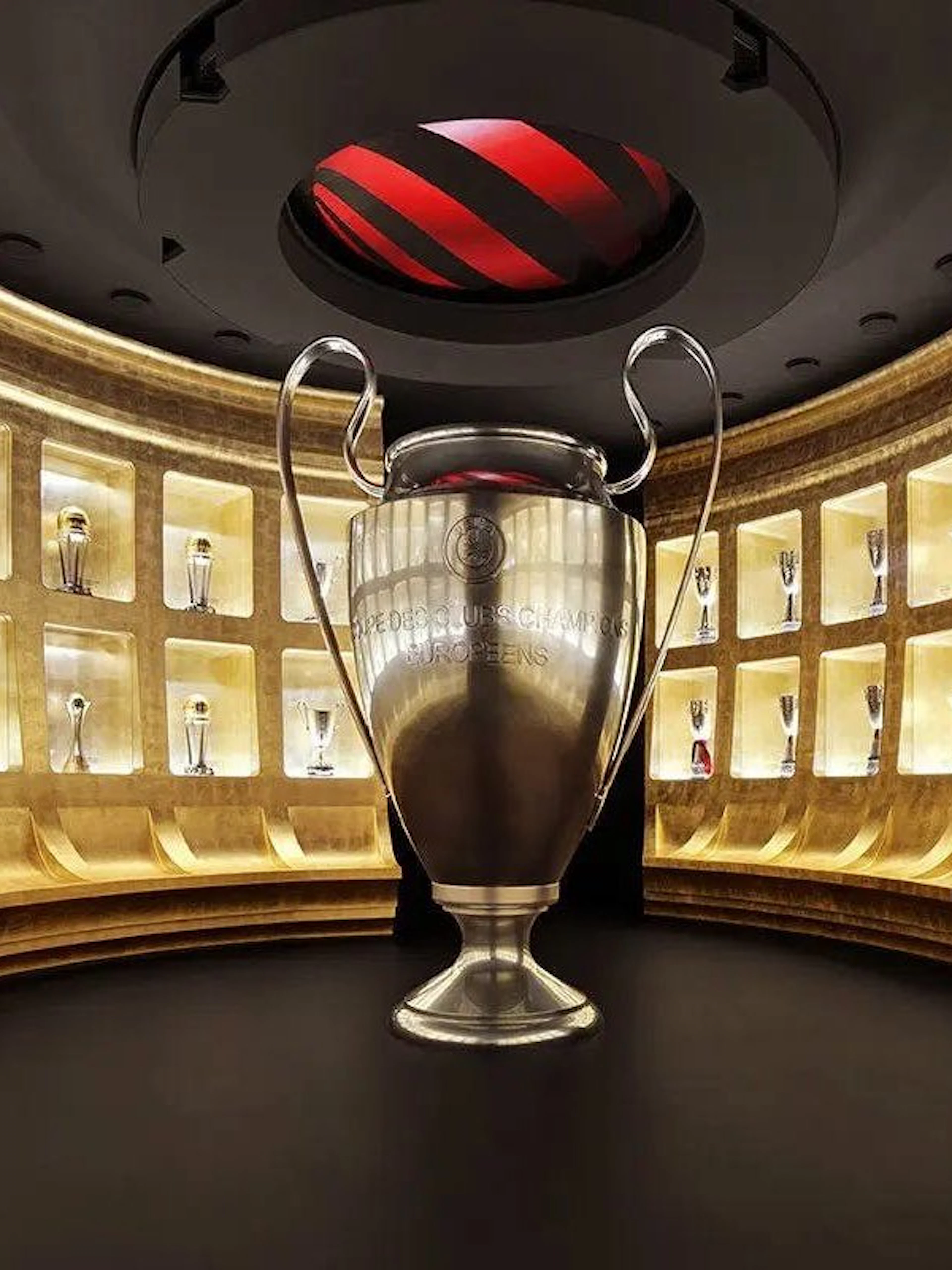 Trophy room with large cup display at Casa Milan Museum, Italy.