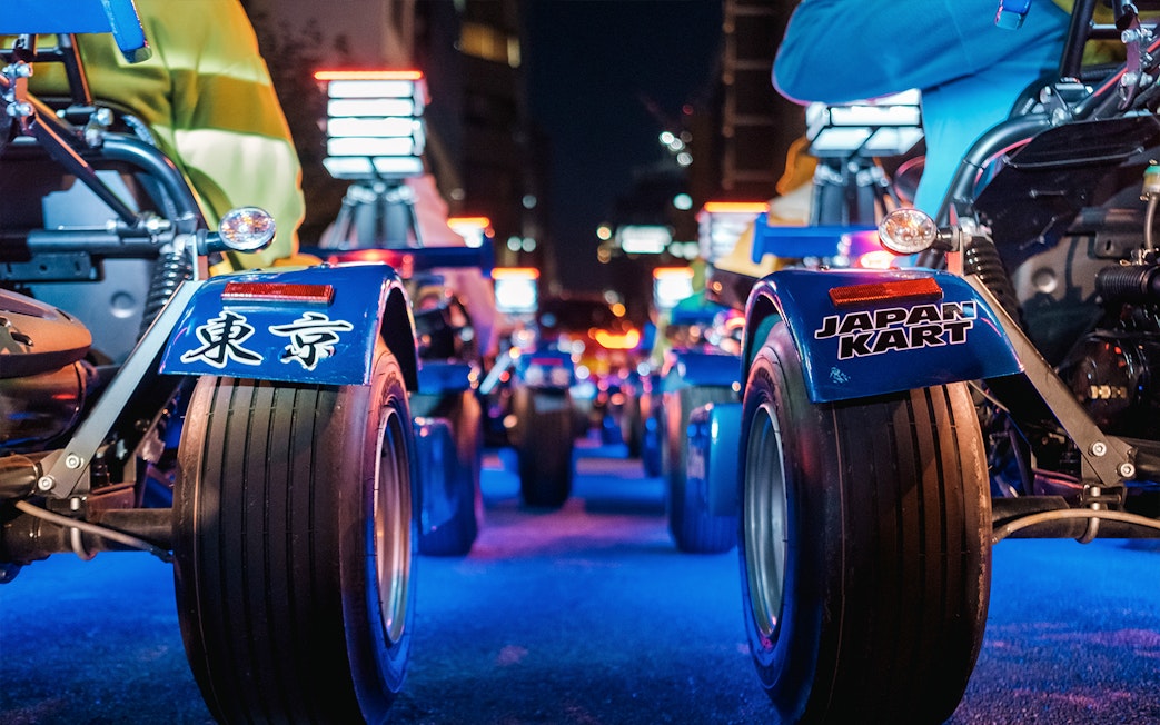 Go-karts lined up for a night tour in Shibuya and Shinjuku, Tokyo.