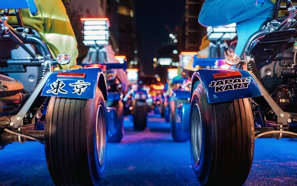 Go-karts lined up for a night tour in Shibuya and Shinjuku, Tokyo.