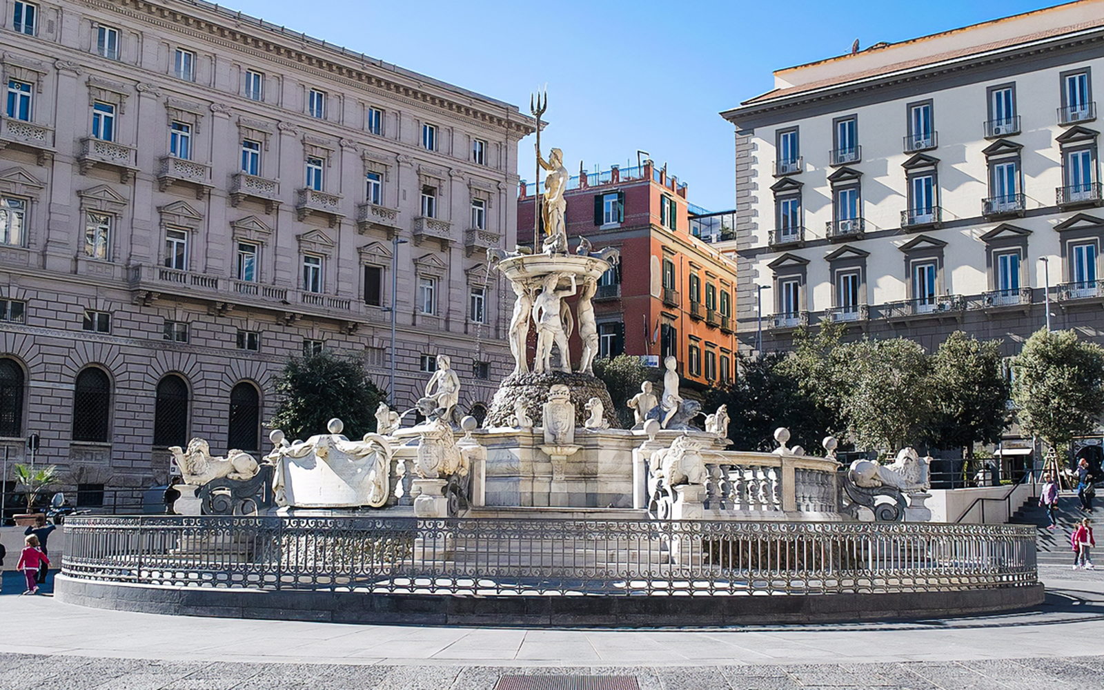 Fountain of Neptune in Naples city square during guided walking tour.