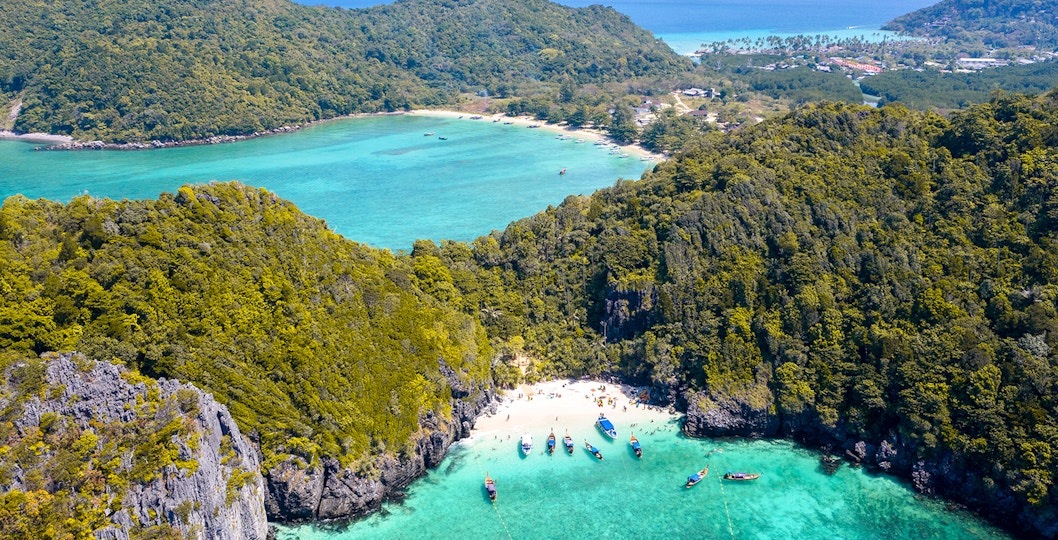 Aerial view of Phi Phi Island, Maya Bay with boats in turquoise waters, Thailand.