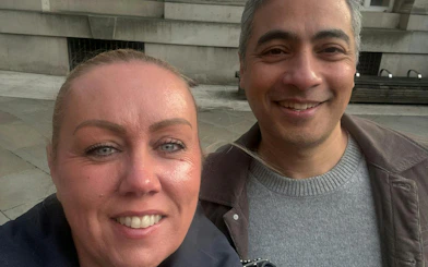 Two people smiling during the Manchester Secret Society Mystery city exploration game.