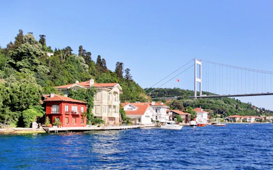 Waterside residences at Kanlica, Bosporus with Fatih Sultan Mehmet Bridge, Istanbul.