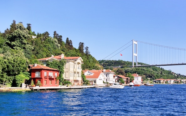 Waterside residences at Kanlica, Bosporus with Fatih Sultan Mehmet Bridge, Istanbul.