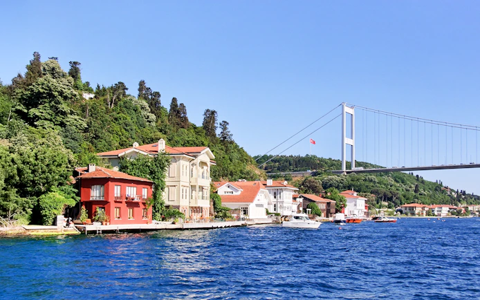 Waterside residences at Kanlica, Bosporus with Fatih Sultan Mehmet Bridge, Istanbul.