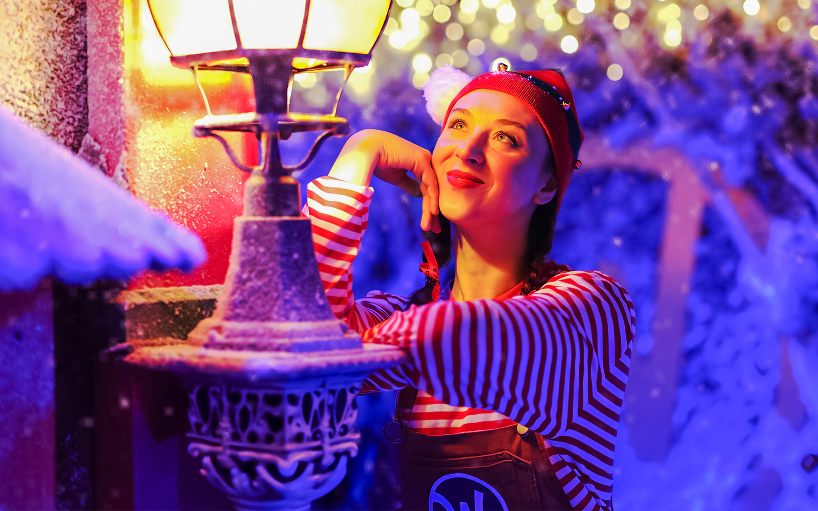 Santa's elf admiring festive lights at Wundrful World of Christmas, Sydney.