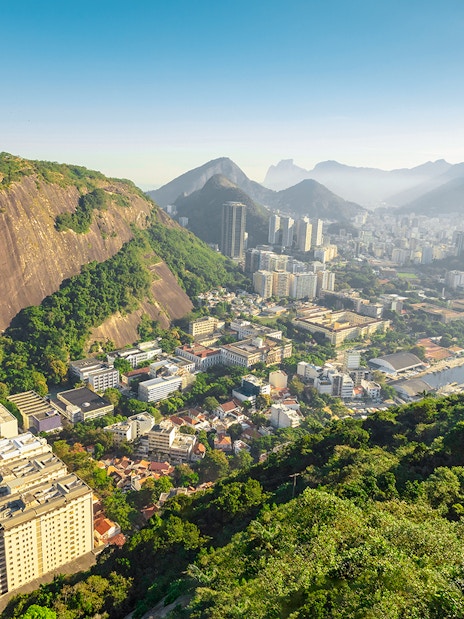 Cable car ascending Pao de Acucar with view of Rio de Janeiro, Brazil.