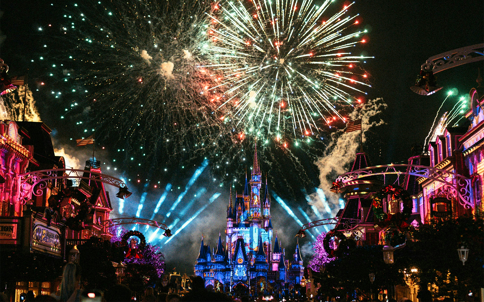 Fireworks over Cinderella Castle during Christmas at Walt Disney World Orlando.