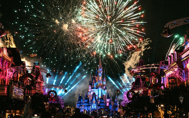 Fireworks over Cinderella Castle during Christmas at Walt Disney World Orlando.