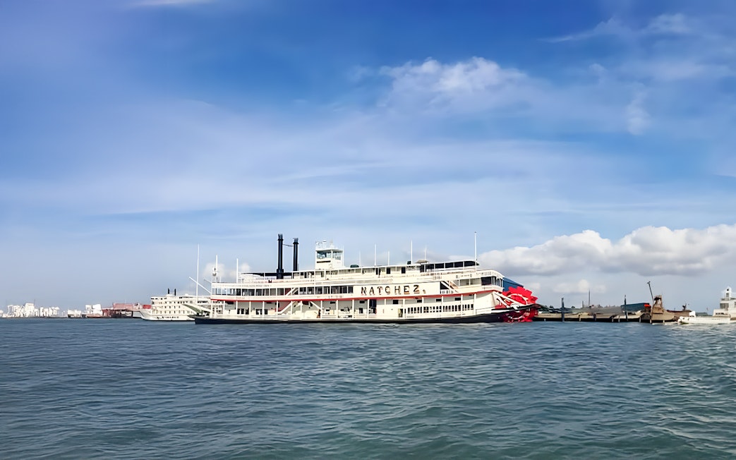Steamboat Natchez cruising on the Mississippi River in New Orleans.