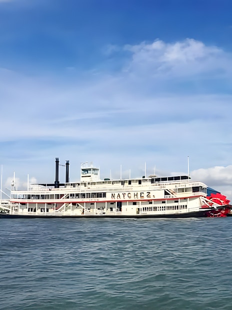 Steamboat Natchez cruising on the Mississippi River in New Orleans.