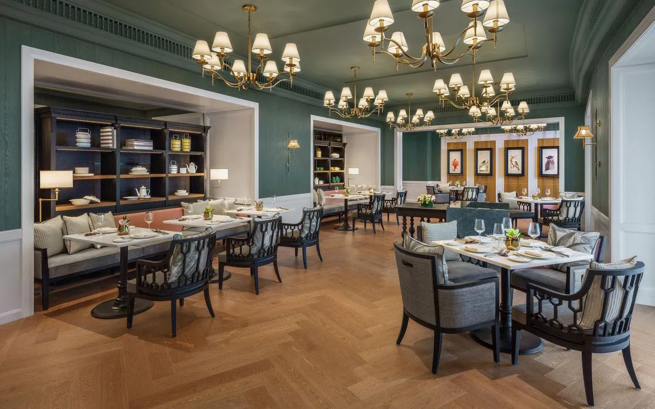Elegant dining area at Resort World Sentosa with tables set for guests.