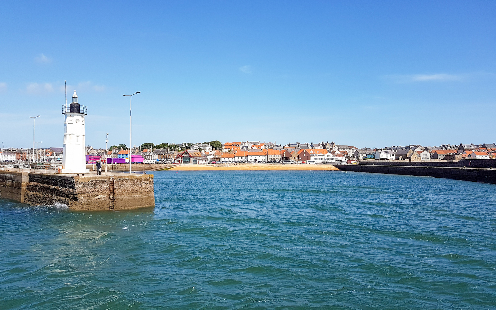 Lighthouse and coastal village view in Fife, Scotland, part of St Andrews tour.