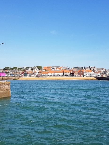 Lighthouse and coastal village view in Fife, Scotland, part of St Andrews tour.