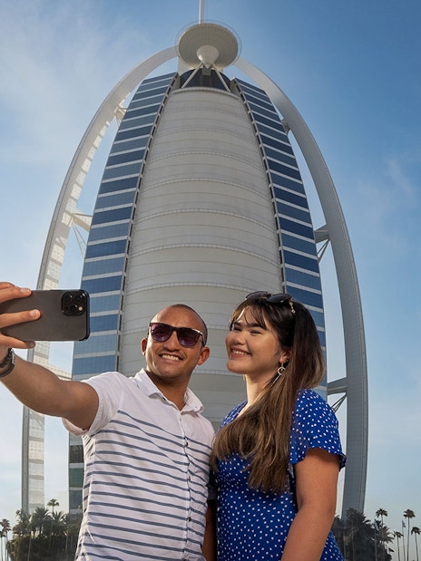 Tourists taking a selfie in front of Burj Al Arab during Inside Burj Al Arab Tour in Dubai.
